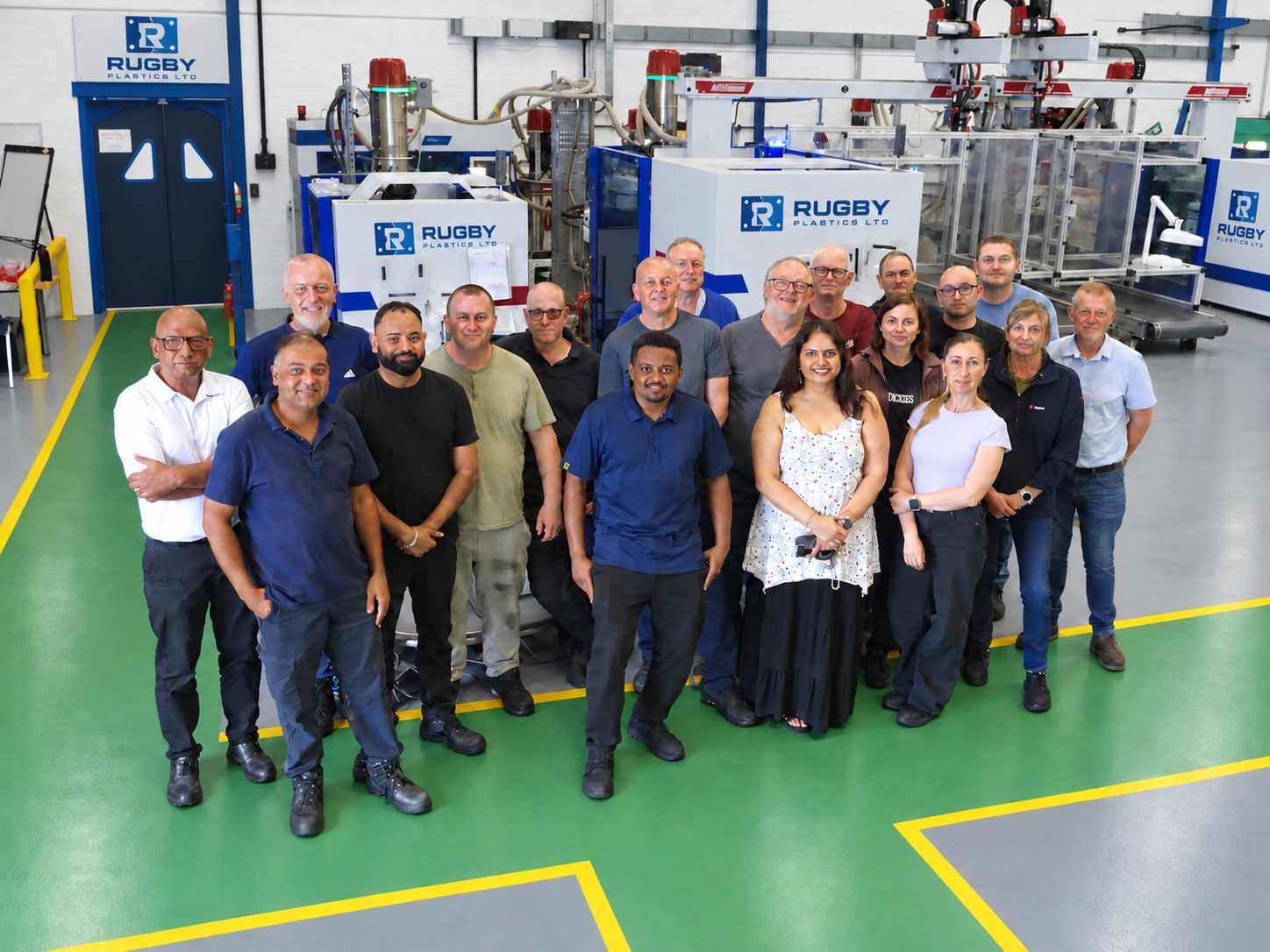 The Rugby Plastics Ltd team together on the factory floor